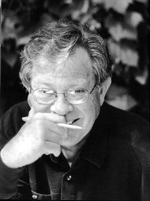 Photo of Dale Warland smiling with a pencil in his hand