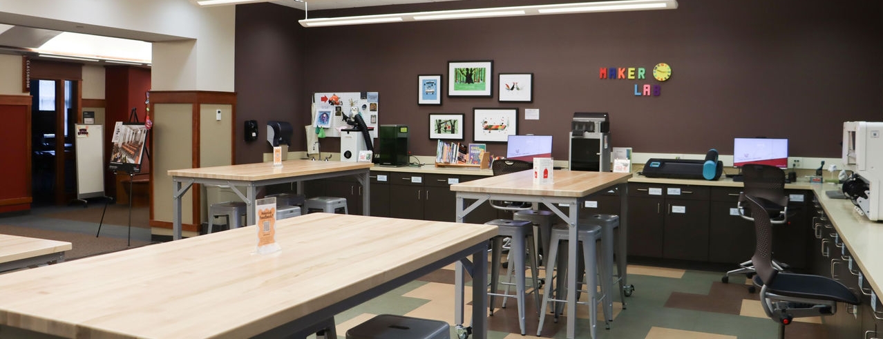 The MakerLab in the CECH Library - including tables, chairs, a 3-D printer, and more.