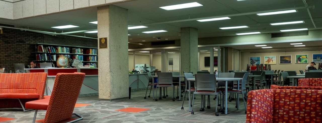 Glass entrance with the text "Clermont College Library." 