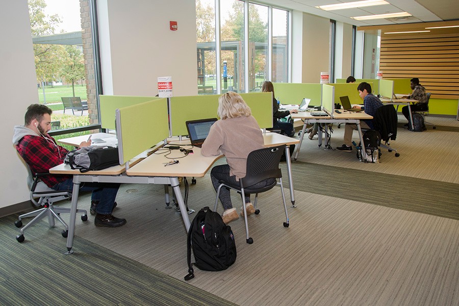 UCBA Students studying in quiet study carrells.